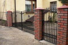 A modern gate with a wicket